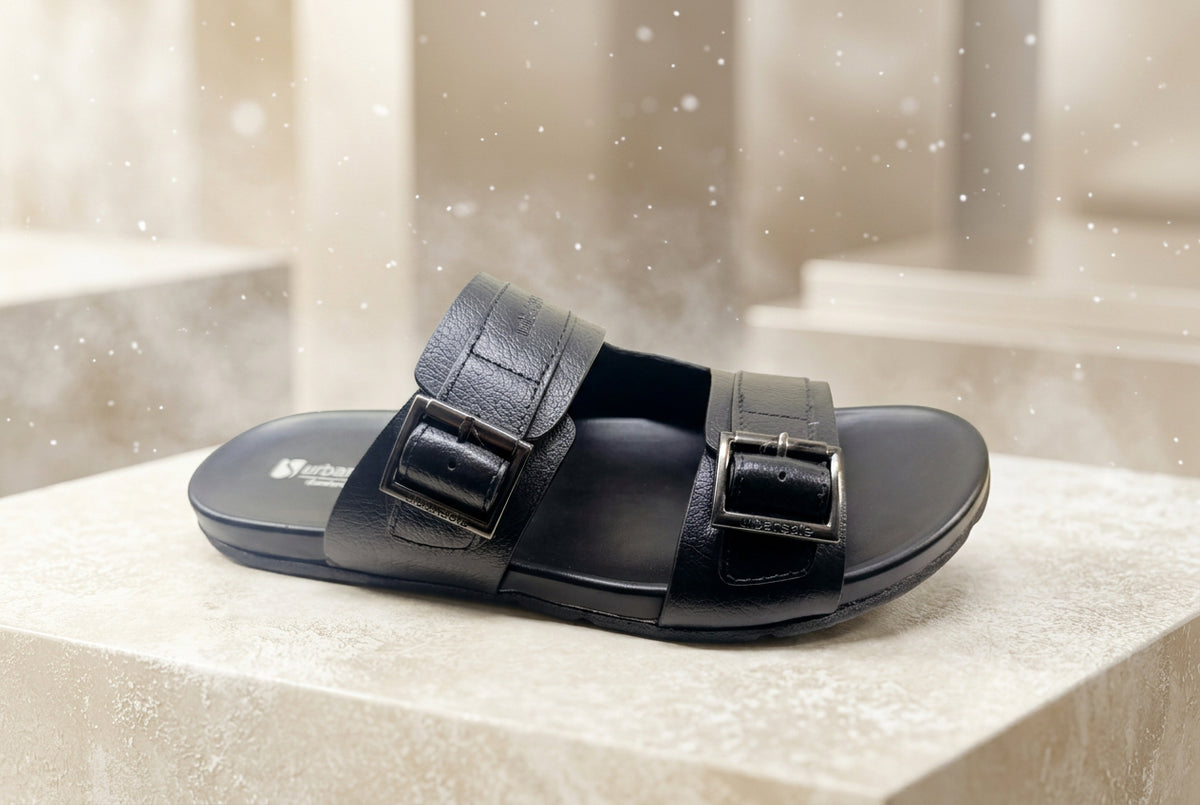 Black Slipper with two straps on a light background