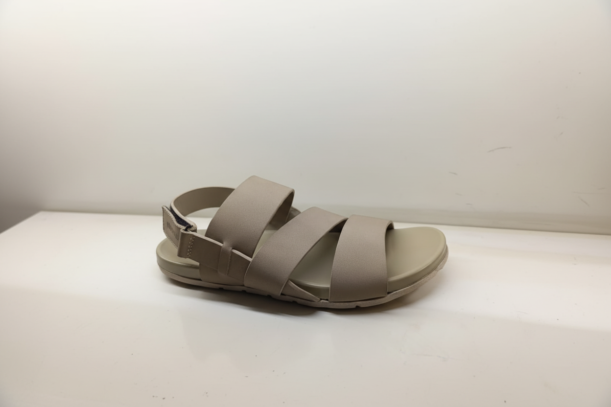 Beige sandal with multiple straps on a white background