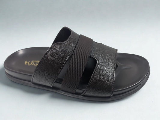 Black sandal with strap design on a light gray background