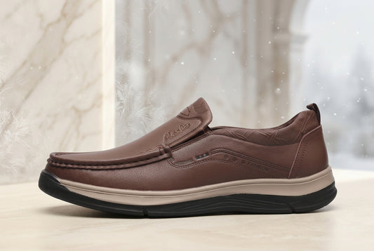A brown slip-on driving shoe with a textured leather upper, a beige midsole, and a black outsole, shown from a side profile view on a white background.