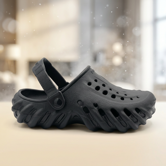 Black clog shoe on a white background