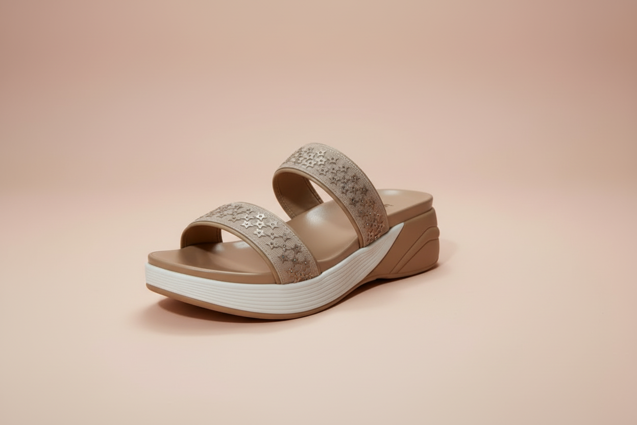Beige sandal with white sole on a beige background