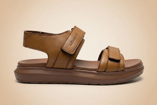 Brown sandal with a strap on a beige background