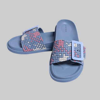 Pair of blue slides with pixelated strap on a white background