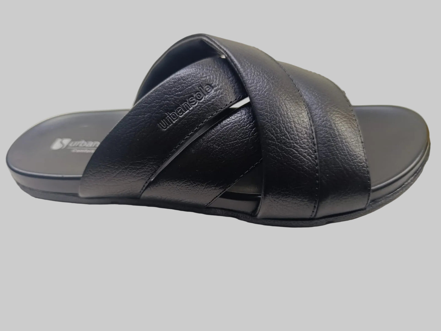 Black sandal with 'Wondershoes' branding on a light surface