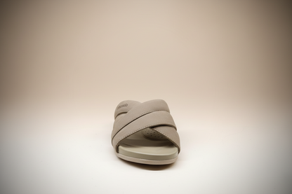 Beige sandal with 'Urban Slide' branding on a white surface
