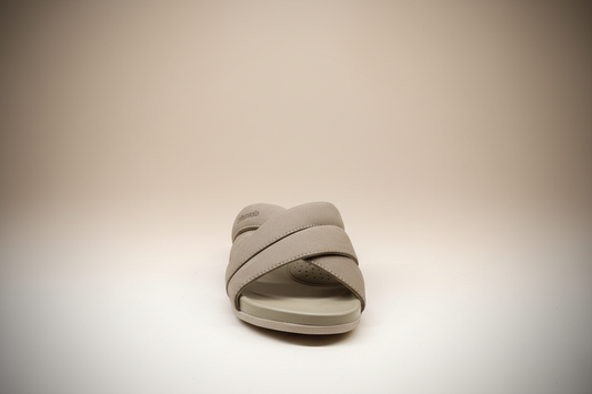 Beige sandal with 'Urban Slide' branding on a white surface