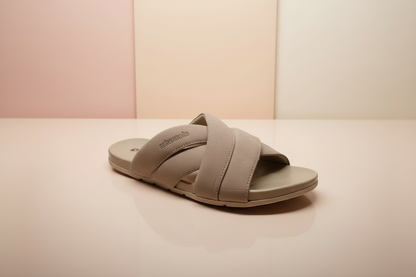 Brown sandal with 'Padders' branding on a light pink background