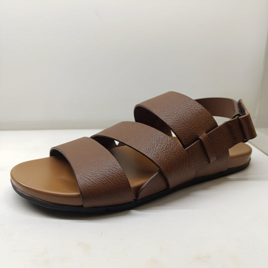 Brown sandal with multiple straps on a white background