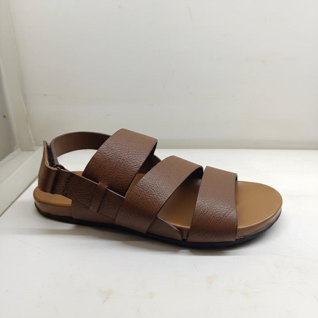 Brown sandal with multiple straps on a white background