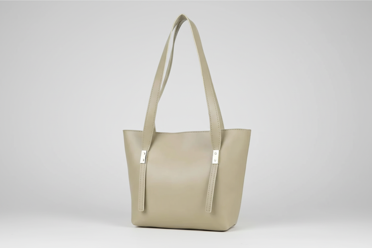 Beige handbag with a strap on a white background