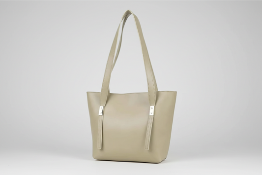 Beige handbag with a strap on a white background