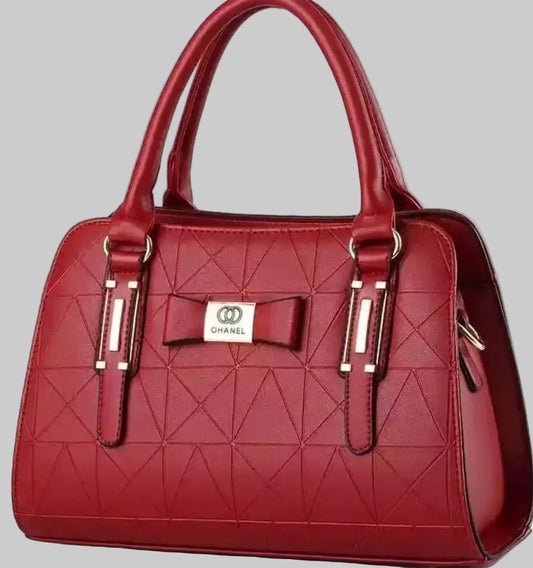 Red handbag with a bow detail on a white background