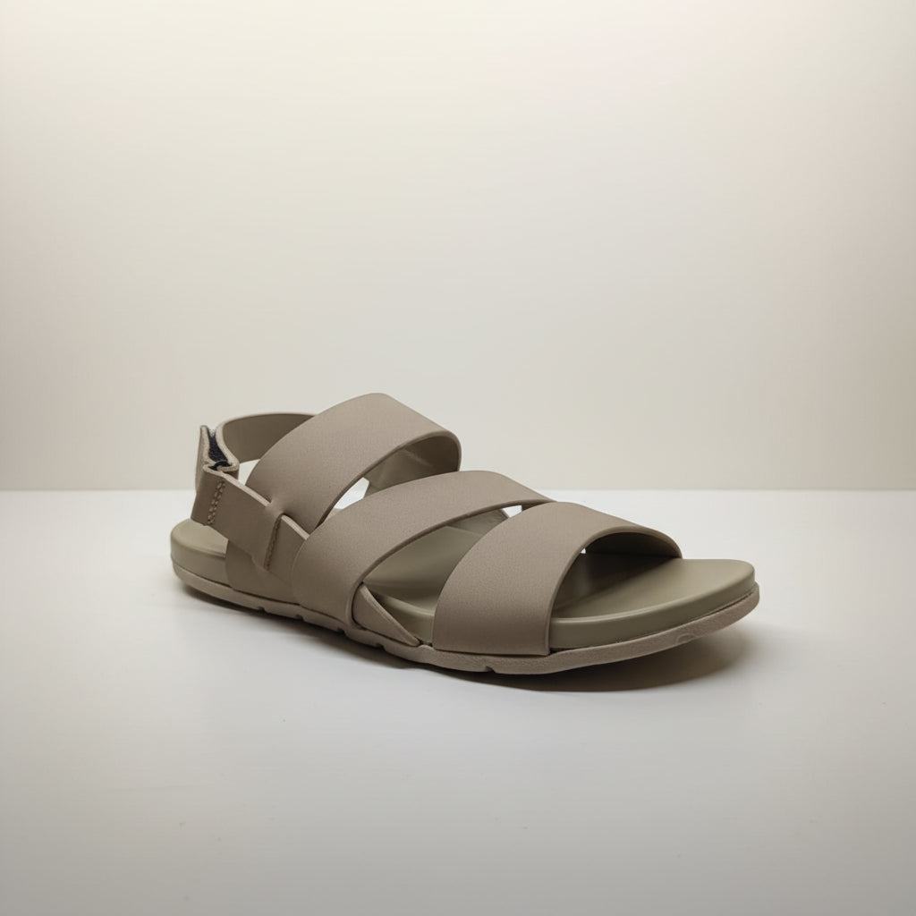 Beige sandal with multiple straps on a white background