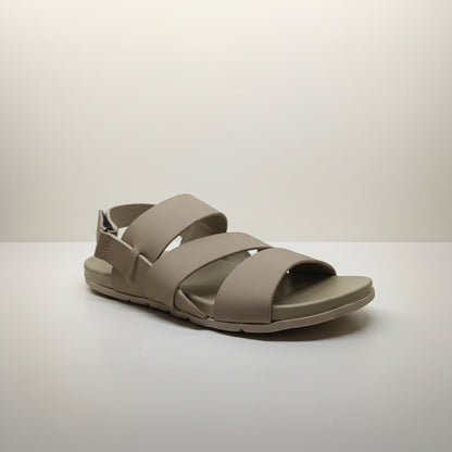 Beige sandal with multiple straps on a white background