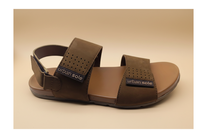 Brown sandal with 'urban sole' label on a beige background