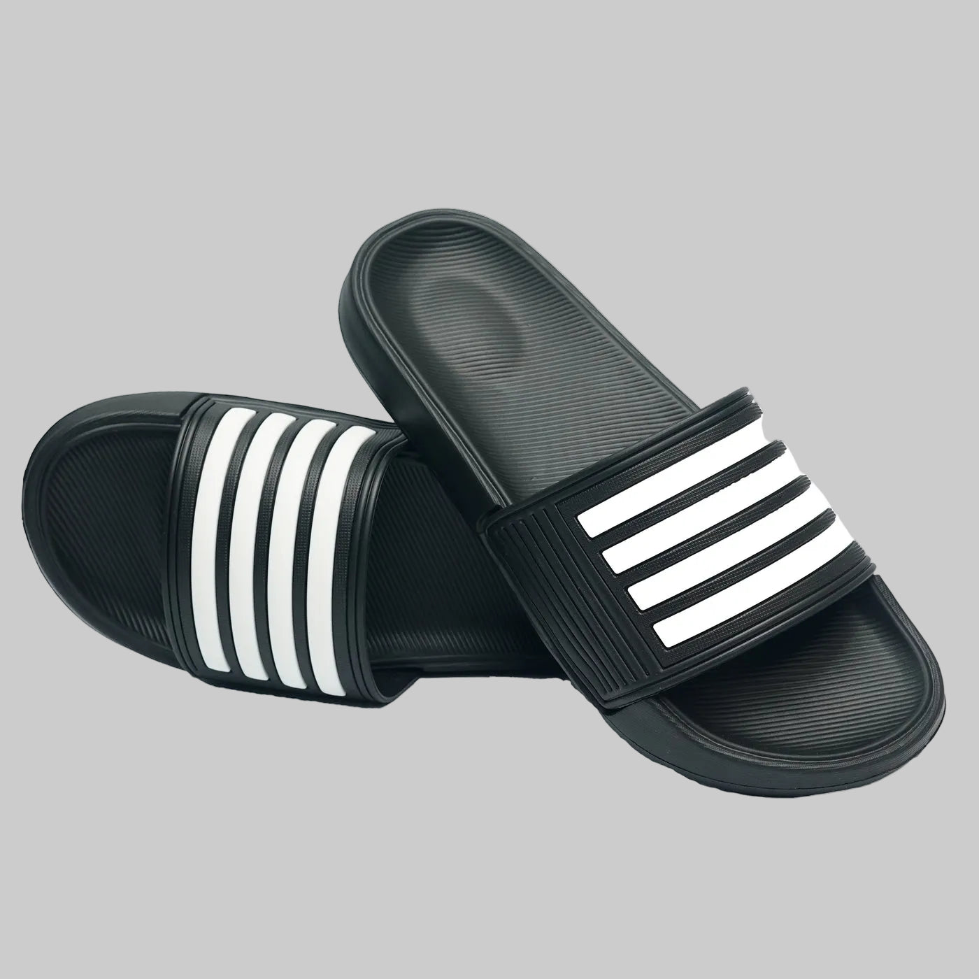Black slides with white stripes on a white background