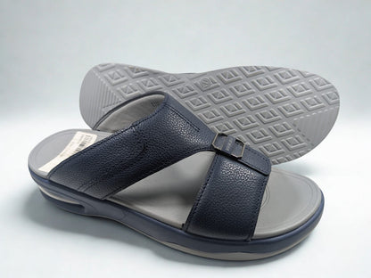 Navy sandal with gray sole on a light gray background
