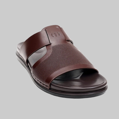 Brown sandal with a textured strap on a white background