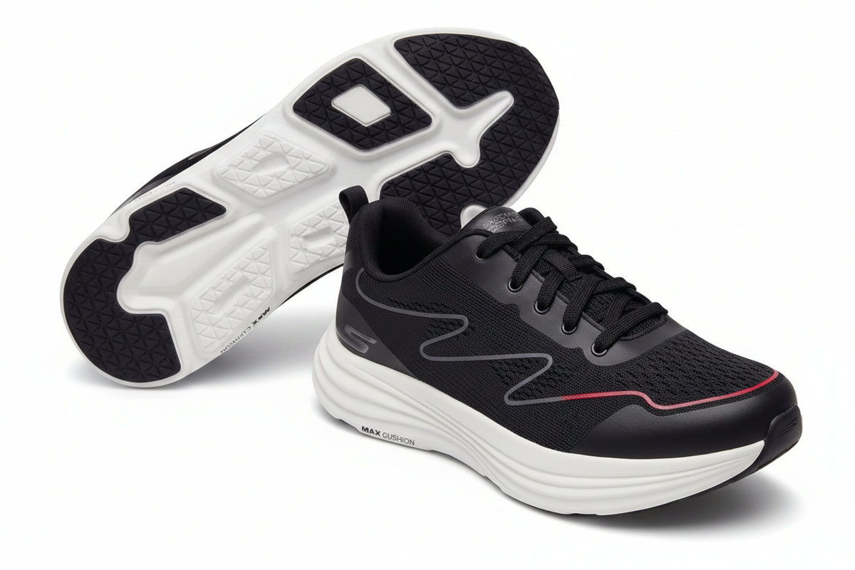 A pair of black athletic sneakers with white midsoles and a thin red accent line on the toe, shown against a neutral gray background. One shoe is positioned upright to display the sole, while the other is shown from the side profile.