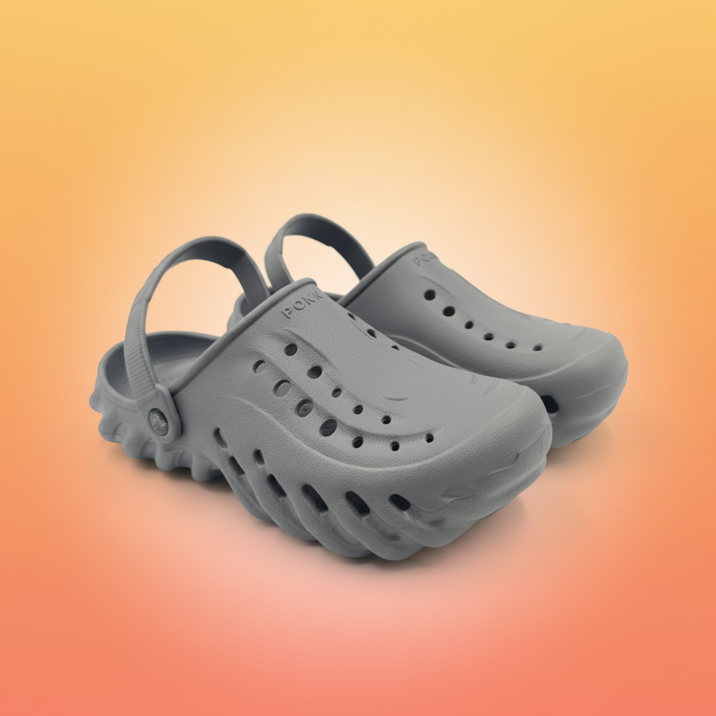 Pair of gray clogs on a white background