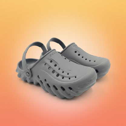 Pair of gray clogs on a white background