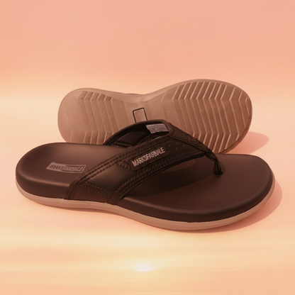 Black sandals with gray soles on a white background