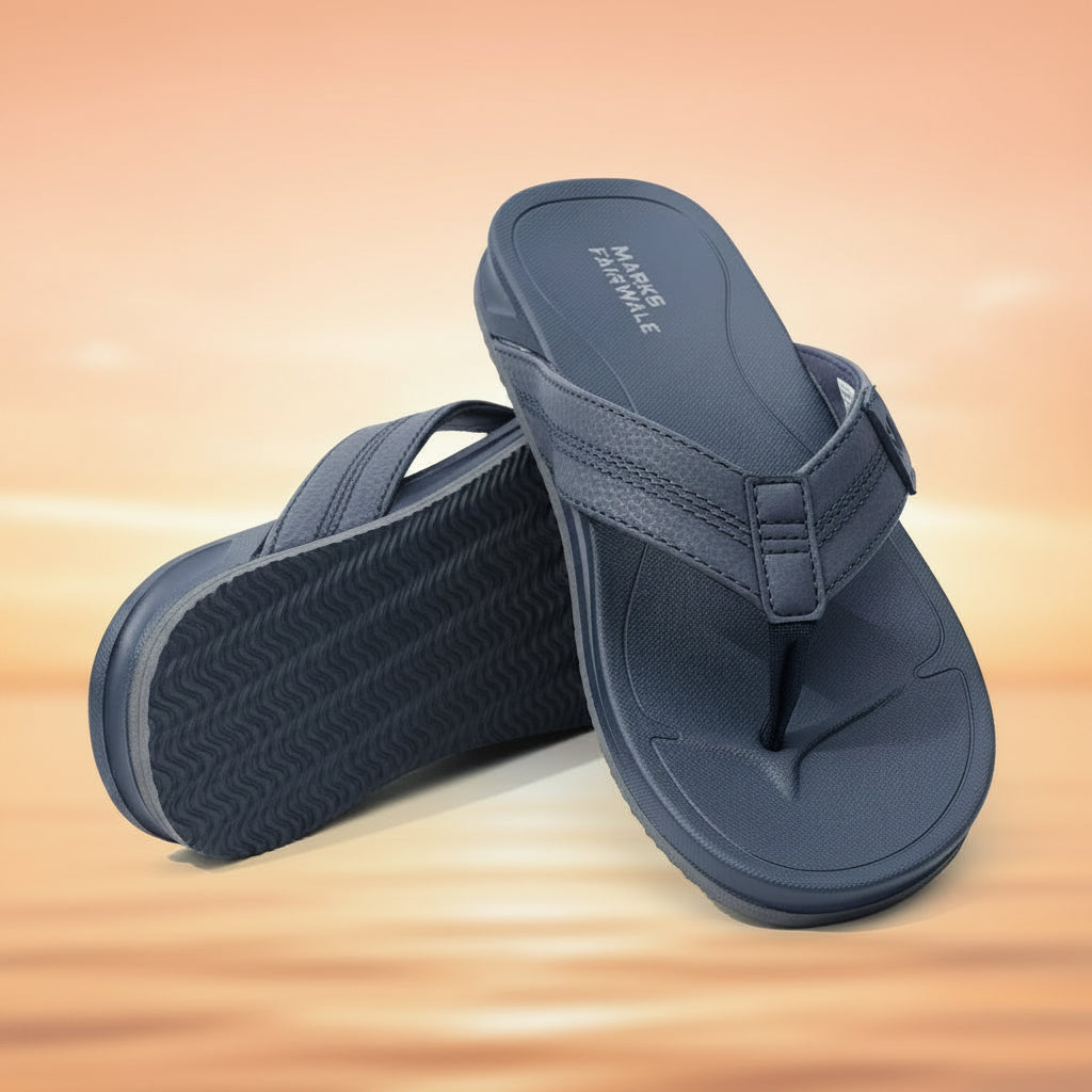 Pair of blue sandals with textured sole on a white background