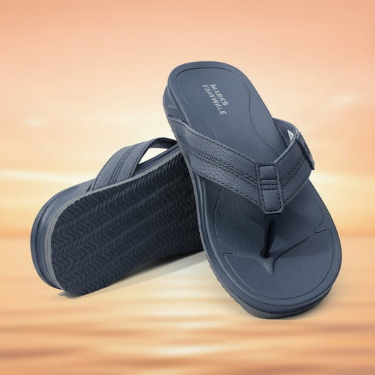 Pair of blue sandals with textured sole on a white background