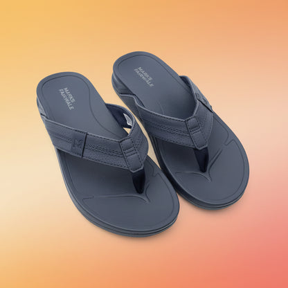 Pair of navy sandals on a light fabric background
