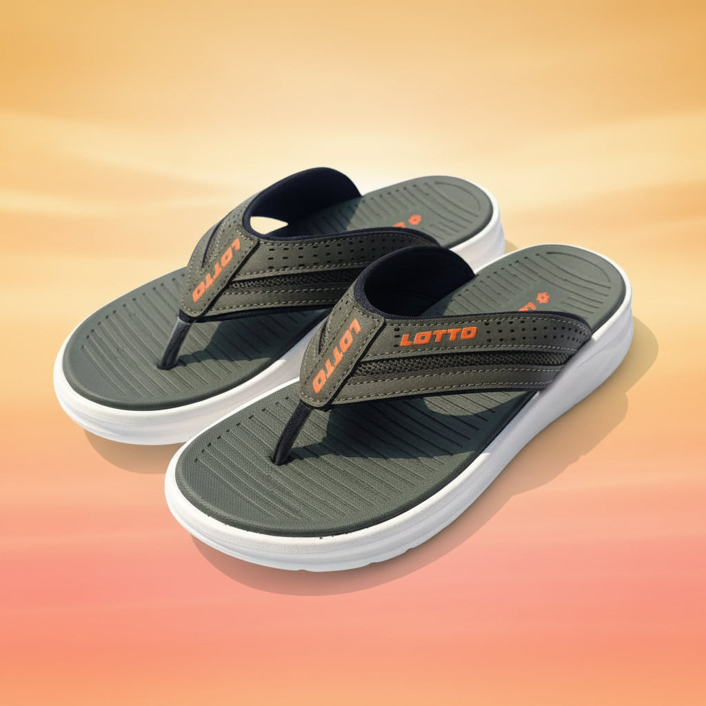 Pair of green slipper with orange logo on a white fabric background