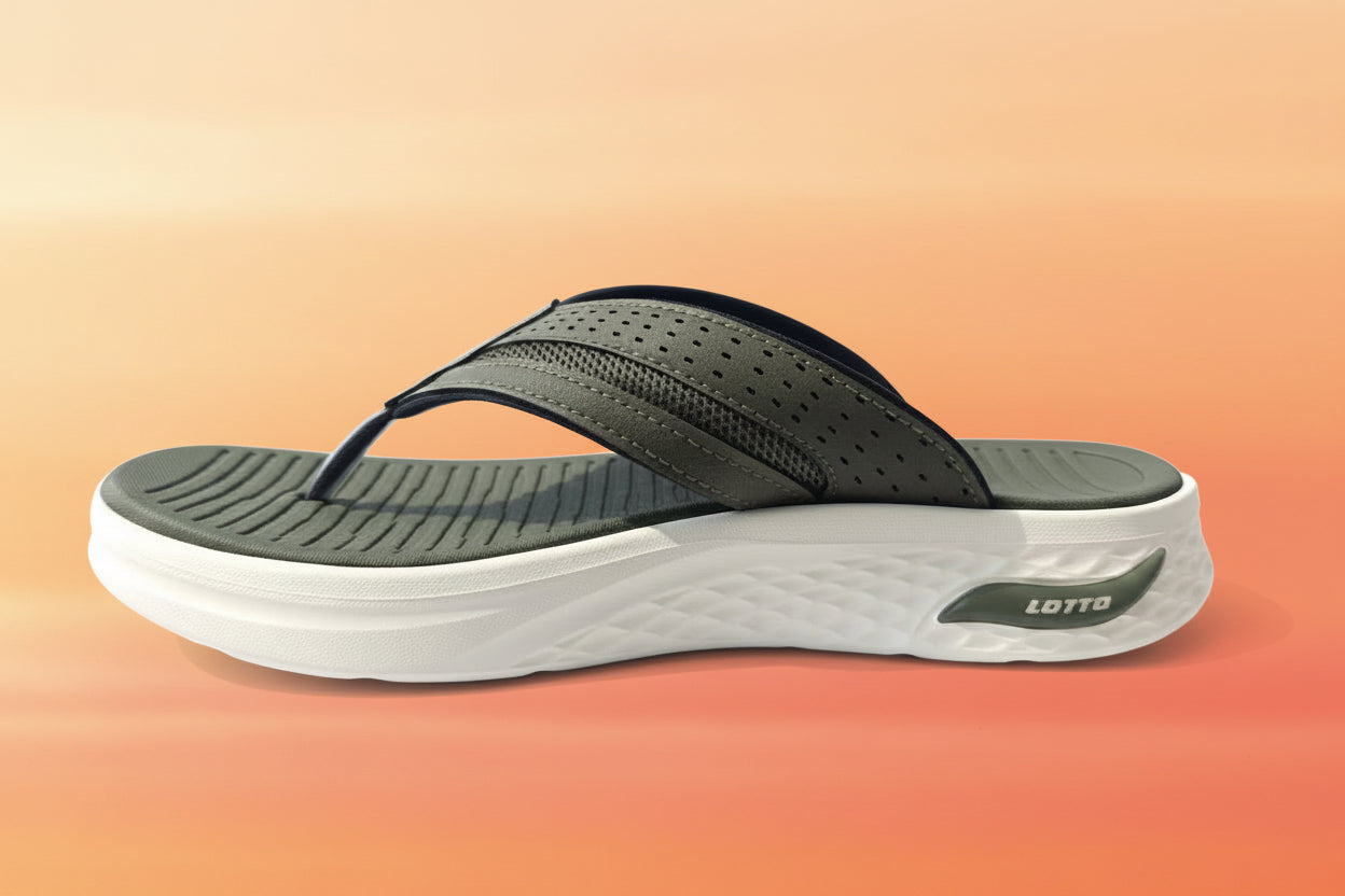 Green sandal with white sole on a light gray background