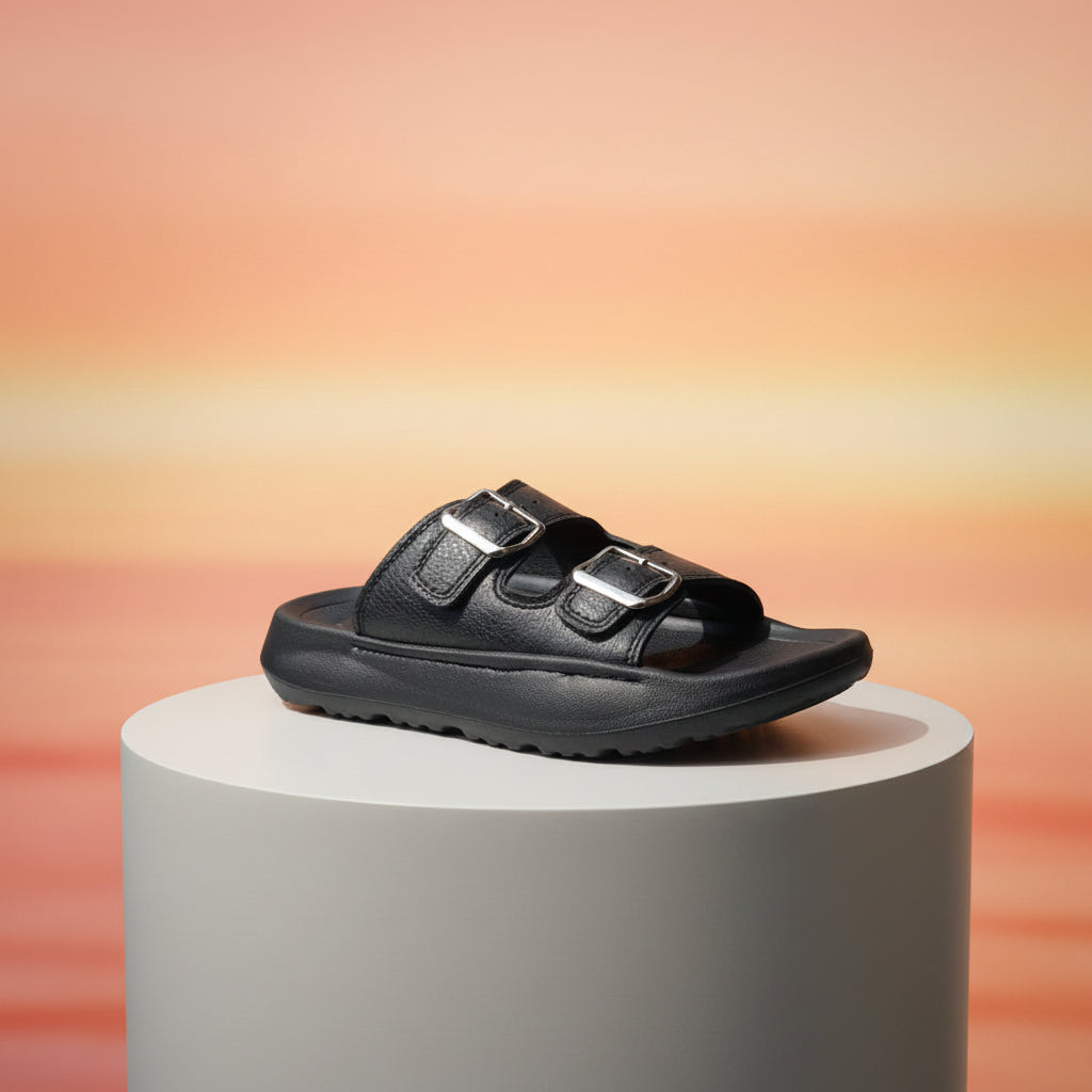 Black sandal with double straps on a white background