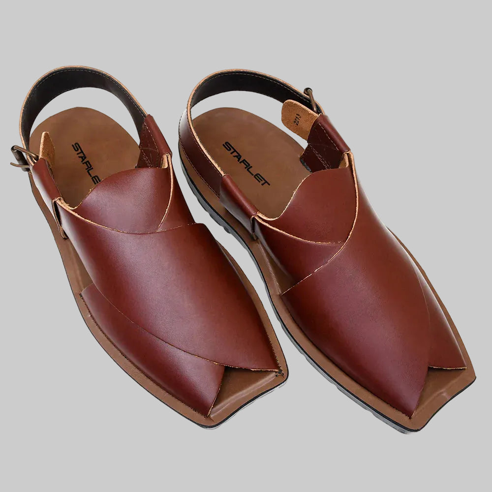Pair of brown leather sandals on a white background