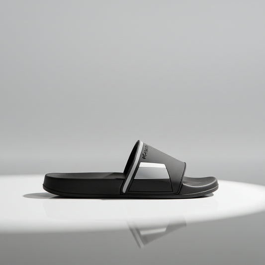 Black slide sandal on a white background