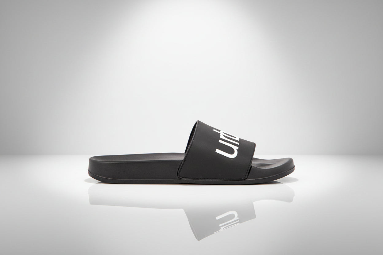 Black slide sandal on a white background