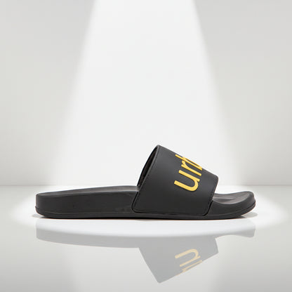 Black slide sandal with gold logo on a white background