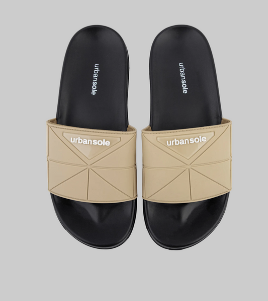 Pair of black and beige slides with 'urbansole' branding on a white background