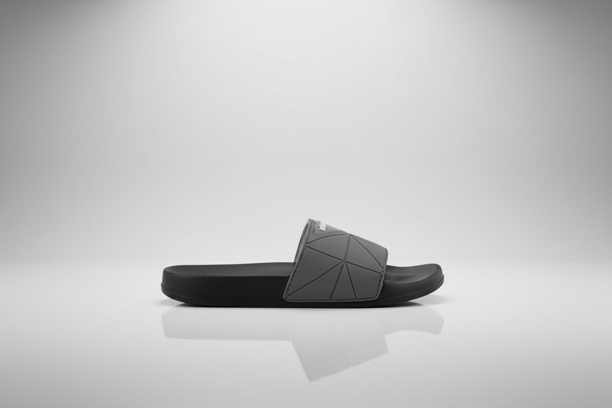 Black sandal with 'REEF' branding on a white background