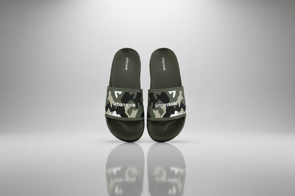 Pair of green camouflage slides with 'urbansole' branding on a white background