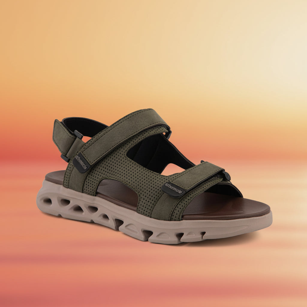 Green sandal with brown sole on a white background