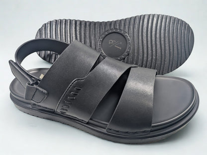 Black sandals with velcro straps on a light gray background