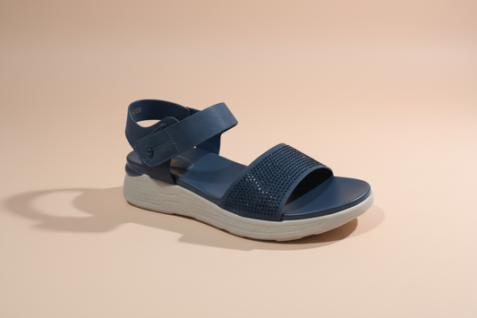 Blue sandal with a platform sole on a tiled floor