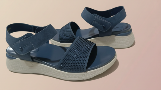 Pair of blue sandals on a tiled floor