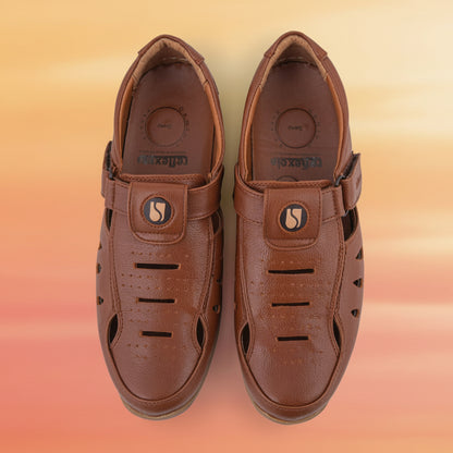 Pair of brown leather sandals on a white background