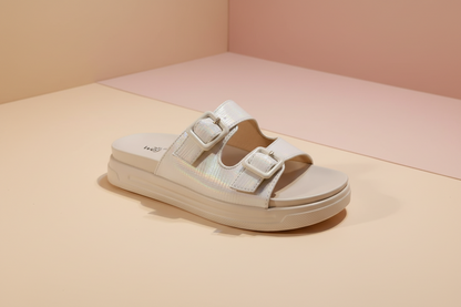 Beige sandal with velcro straps on a white background