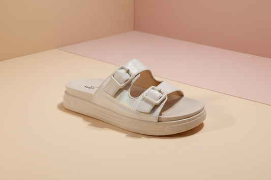 Beige sandal with velcro straps on a white background
