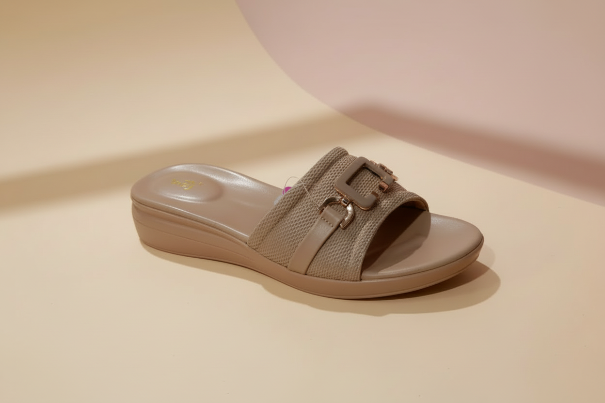 Beige sandal with a strap on a beige background