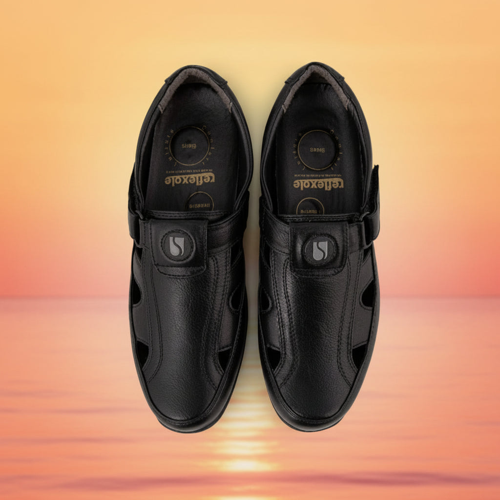 Pair of black shoes with a visible brand logo on a white background