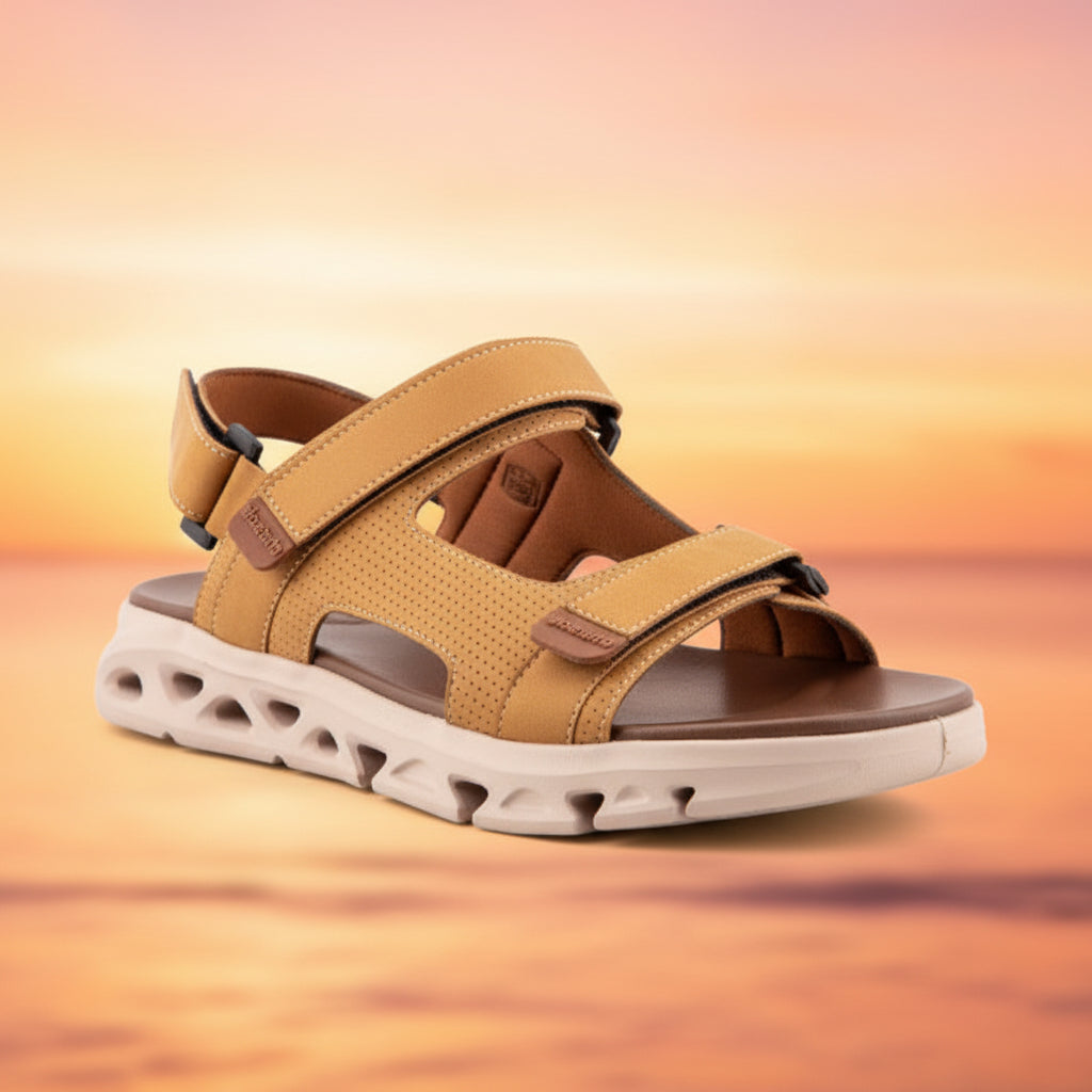 Tan sandal with a white sole on a light gray background